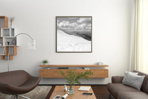 Canadian alpine photograph with a sweeping snow slope beneath dramatic clouds.
