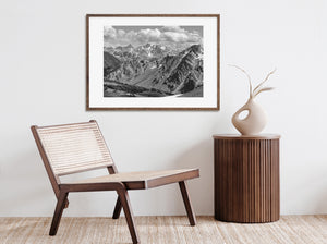 Monochrome Canadian alpine landscape with steep rocky slopes and distant peaks.