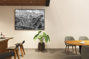 Rugged Canadian mountain landscape with layered peaks and contrasting rock textures.