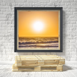 Golden sunset colour fills the sky above rolling Pacific waves.