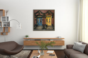 Twin townhouse doors framed by red brick masonry