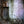 Old wooden doorway surrounded by crumbling brick wall