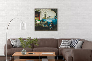 close view of vintage car front end with headlights and chrome trim