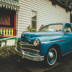 classic car with rain droplets on hood chrome grille detail Ontario street