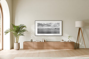 Sault Ste Marie cityscape with river foreground and cloudy sky