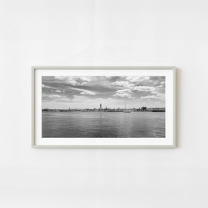 Black and white waterfront view of Sault Ste Marie across the St Marys River