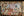 Urban street posters layered over textured graffiti wall
