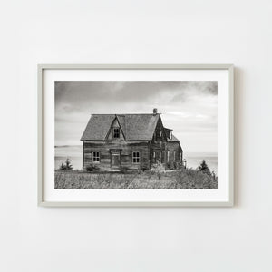 weathered wooden house in Saint Georges de Malbaie Quebec black and white