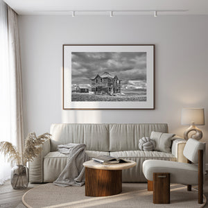 isolated farmhouse with collapsing porch in Saskatchewan landscape