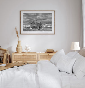storm clouds above abandoned rural building Canadian prairie