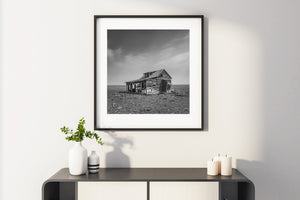 old rural farmhouse decay on flat prairie horizon Canada