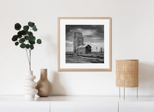 Abandoned prairie grain elevator with railroad tracks rural Saskatchewan