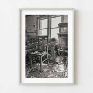 Black and white photograph of an abandoned Saskatchewan schoolhouse interior