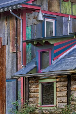 Weathered corrugated metal walls with bright painted trim