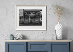 Vintage commercial building facade in Yukon captured in black and white