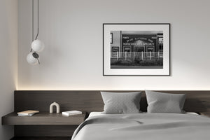 Historic Dawson City street architecture with signage in black and white