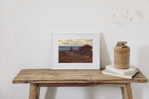 Rugged canyon ridges and isolated rock towers stretch across the Utah desert.