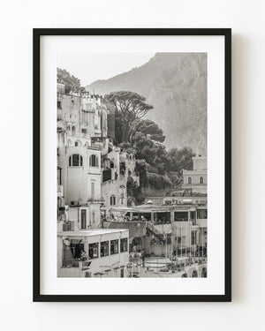 Black and white photograph of hillside homes and trees in Capri, Italy.