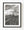 Black and white photograph of railway tracks leading toward a grain elevator in Chamberlain, Saskatchewan.