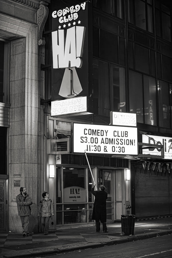 Comedy club sign change in progress in New York City