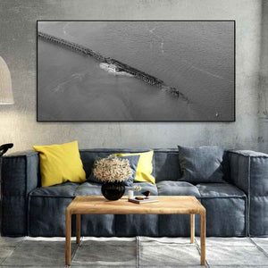 An isolated terminal trestle stretches over the river beneath subtle surface ripples.