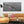 Geometric industrial framework forms a narrow diagonal across a broad expanse of water.