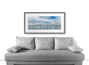 Ravenel Bridge stretches across Charleston water with soft reflections beneath its towers.