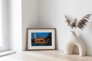 Traditional Chinese bridge in Chengdu with modern city backdrop