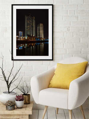 Chengdu high-rise architecture and soft river reflections stand out against the dark night.