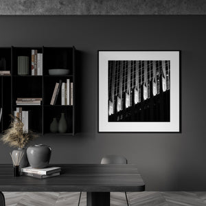 A night facade photograph contrasts bright Art Deco ornament with dark window grids.