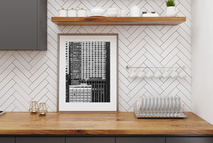 A small cloud of steam interrupts the rigid lines of densely layered Chicago buildings.