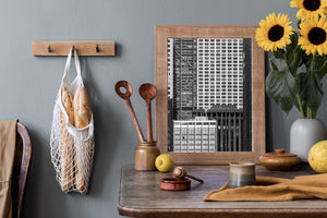 Monochrome urban photograph showing contrasting window patterns across tall Chicago facades.
