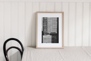Light and shadow separate repeating building grids in a detailed Chicago architectural view.