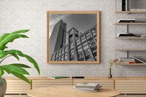Chicago city architecture combines arched brick windows, a clock face and repeating skyscraper lines.
