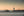 Chicago harbor photograph with a low tugboat, a lighthouse and calm Lake Michigan water.