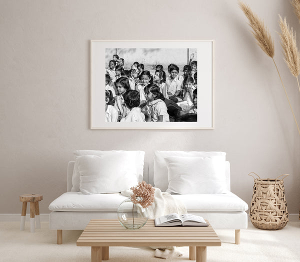 Joyful children sitting together – black and white wall art