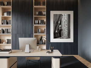 black and white portrait of young monk inside wooden temple window China