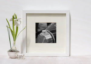 Monochrome photo of Bugatti radiator and cap