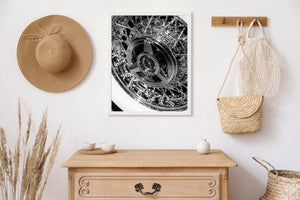 Bright chrome reflections and dark gaps create a geometric pattern across a vintage wire wheel.