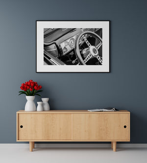 Classic automotive interior featuring steering wheel and instrument cluster