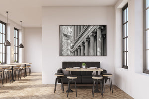 Repeating column capitals and fluted shafts form a rhythmic New York architectural photograph.