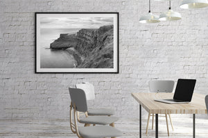 Horizontal black and white Irish landscape photograph showing the Cliffs of Moher along the Atlantic coast.