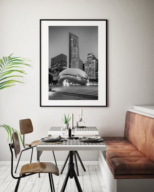 Vertical Chicago photograph showing Cloud Gate’s reflective form beneath the Millennium Park skyline.