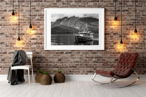 Low cloud obscures a rocky mountain ridge above a British Columbia coastal boat.