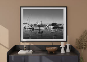 Horizontal Irish coastal photograph showing moored boats and reflected masts in Cobh Harbour.