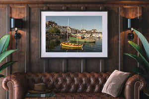 Boats and sea reflections in soft sunset tones from coastal Ireland
