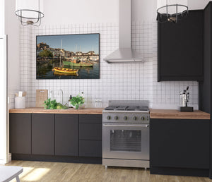 Quiet maritime scene of Cobh’s waterfront under warm sunset skies