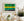 Green and yellow painted train panels show scratches and worn metal surfaces.