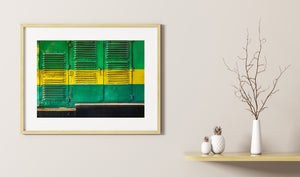 Horizontal Indian train photograph combining green shutters, yellow paint and weathered texture.