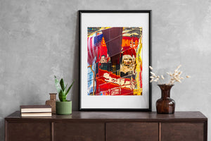 Neon signs and bustling scene reflected on NYC's Broadway